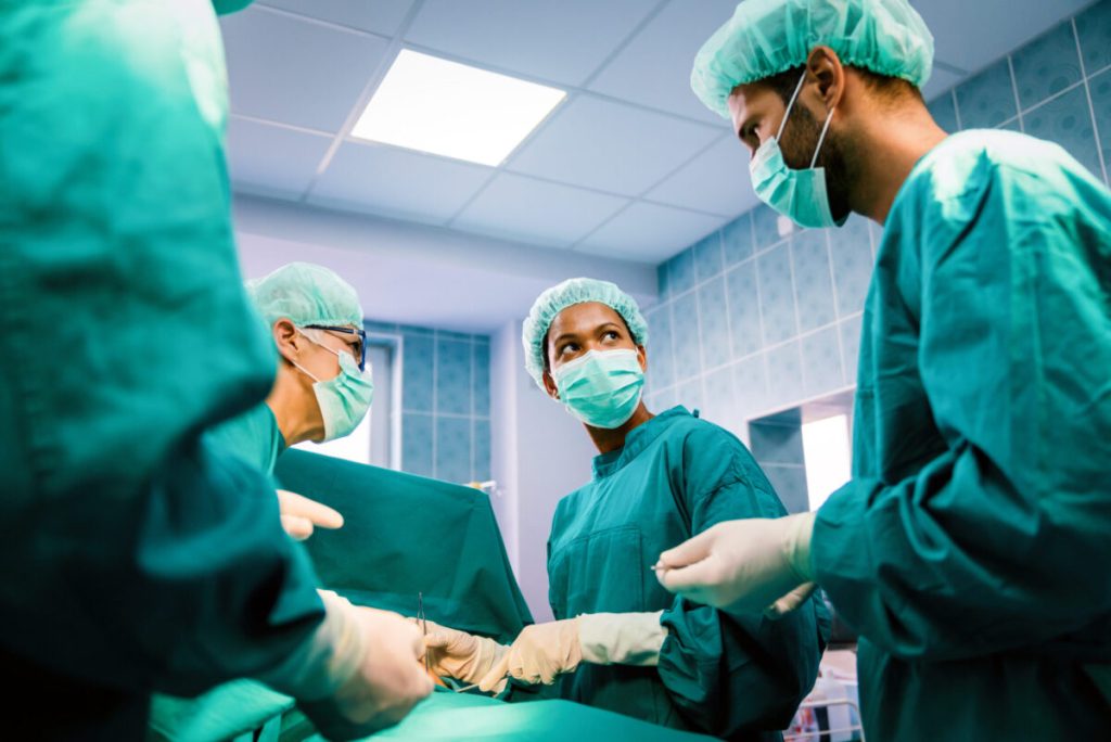medical assistant helping in surgery room