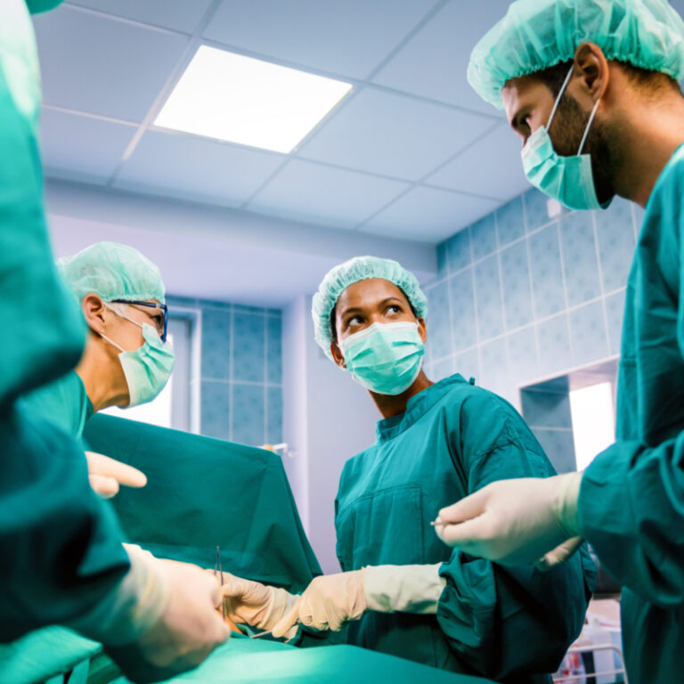 medical assistant helping in surgery room