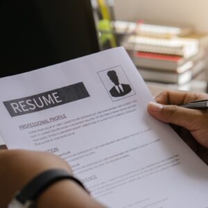 A person writing resume outline