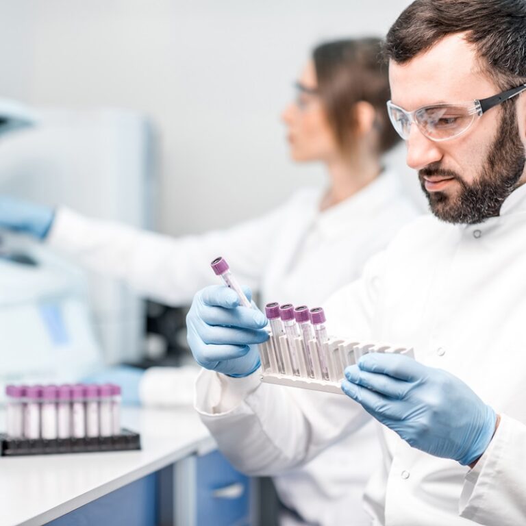 Phlebotomist studying blood kit