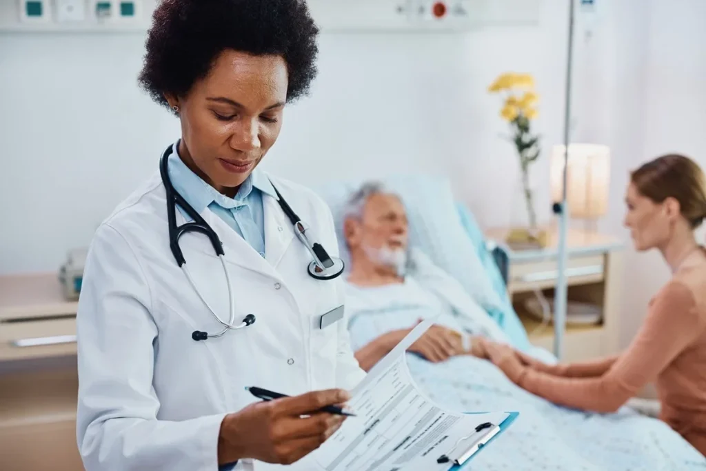 healthcare professional with clipboard checking on patient
