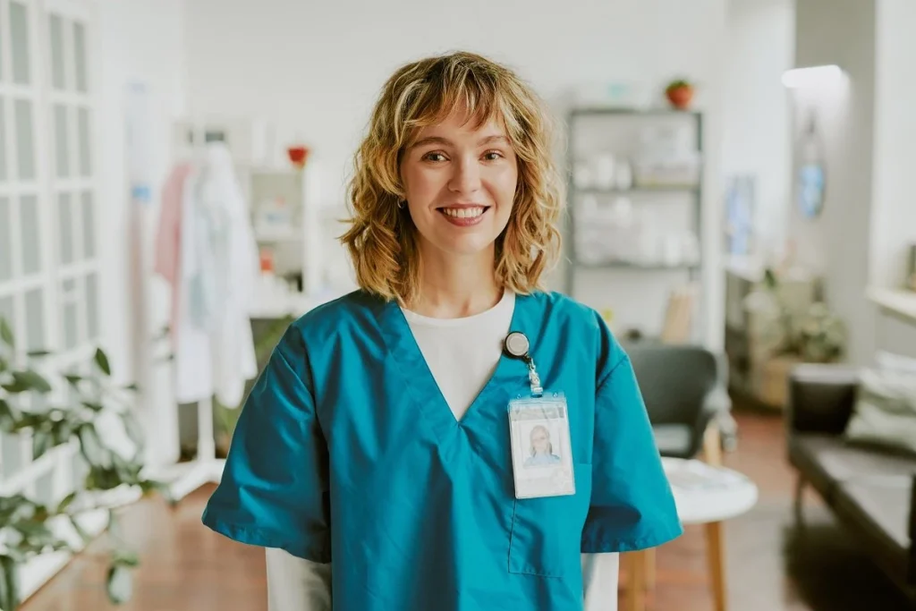 a new graduate RN posing for the camera