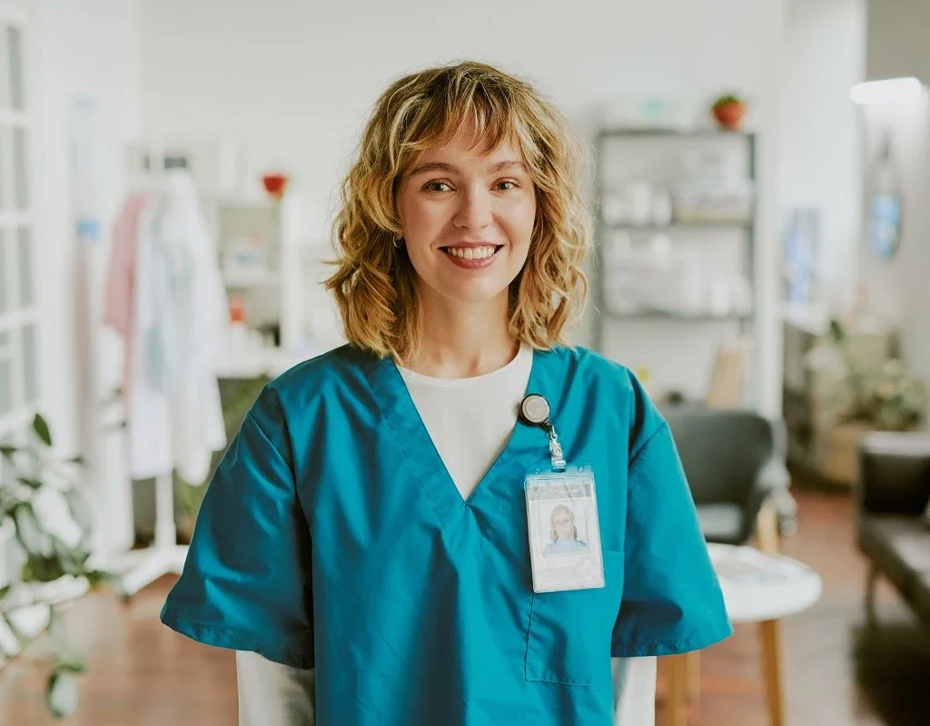 a new graduate RN posing for the camera