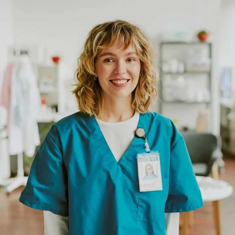 a new graduate RN posing for the camera