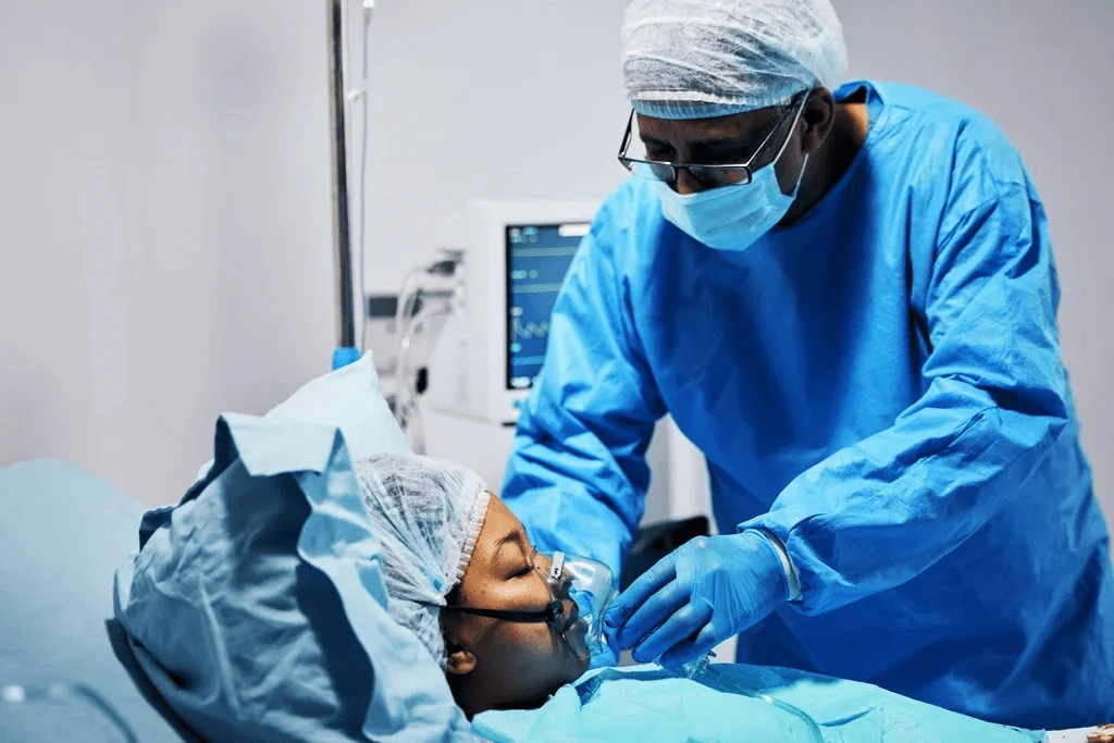 nurse anesthetist putting oxygen on a patient