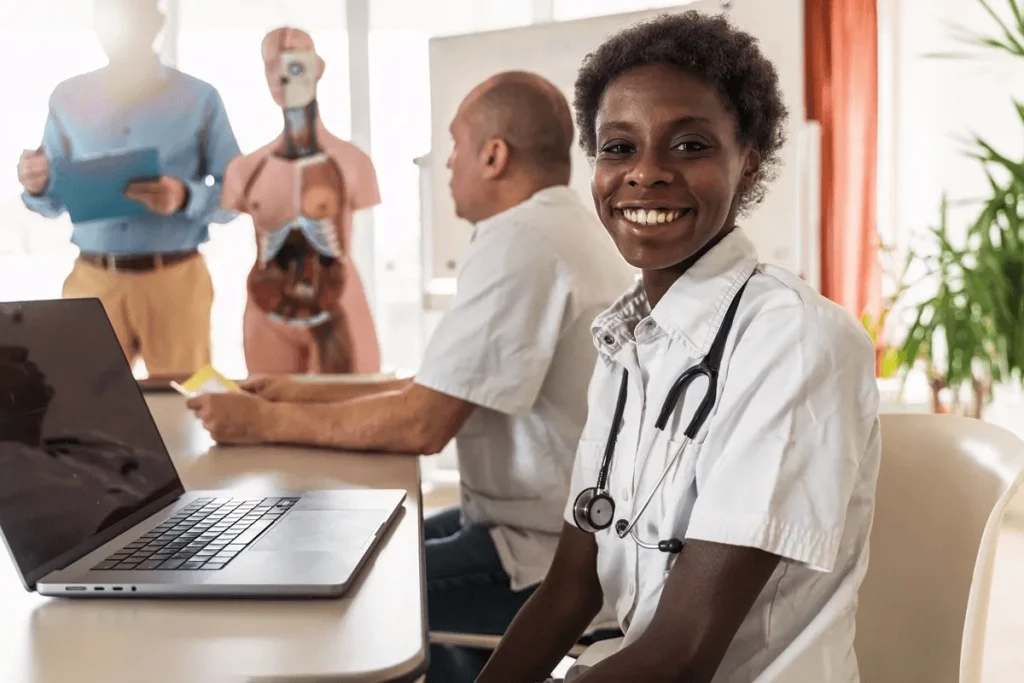 physician assistant performing data entry of patient information