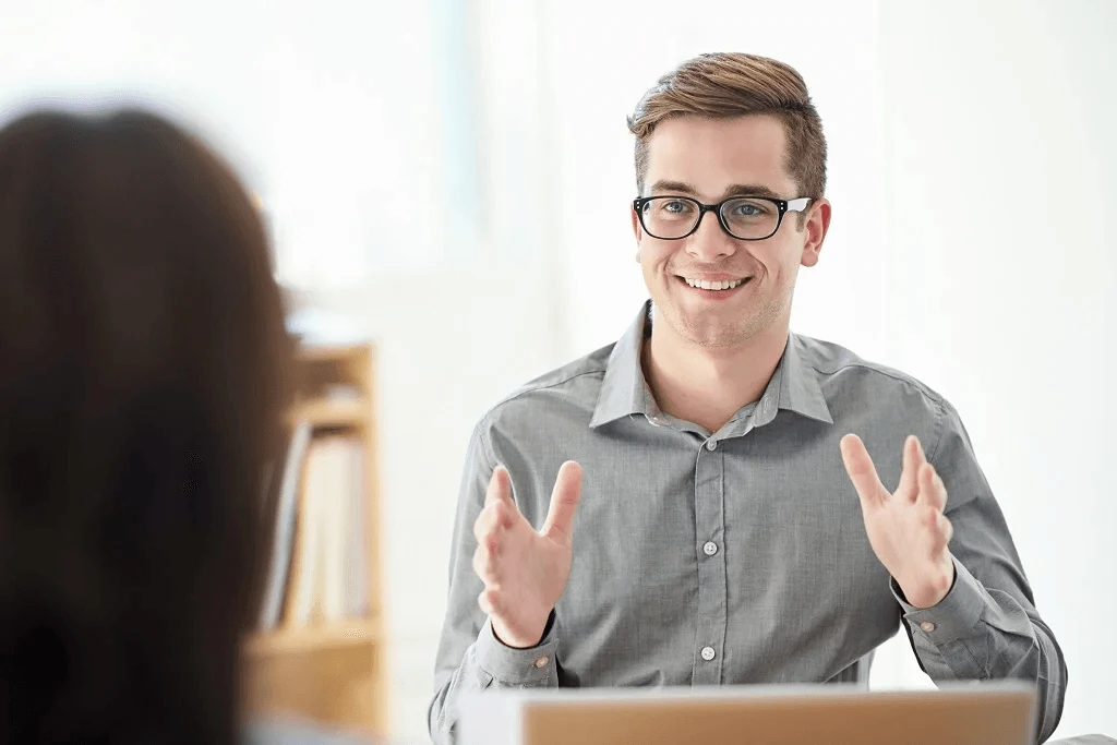 male applicant confidently answering job interview questions