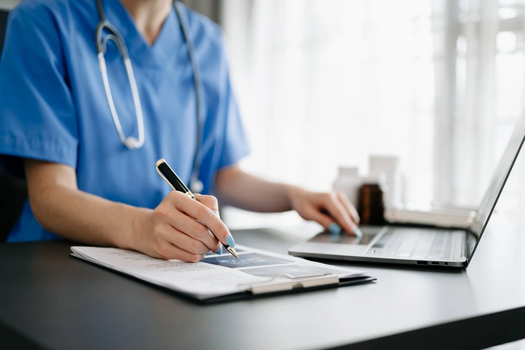 nurse practitioner writing showcasing her detail-oriented skills
