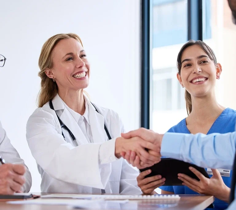 successful medical team meeting, reflecting key resume accomplishments