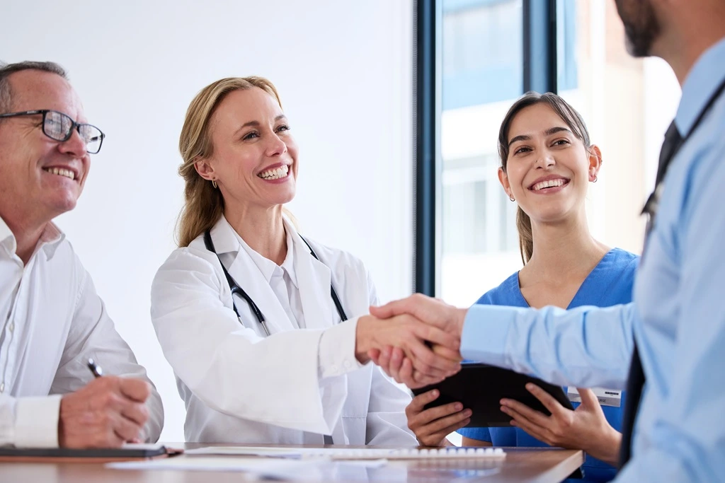 successful medical team meeting, reflecting key resume accomplishments