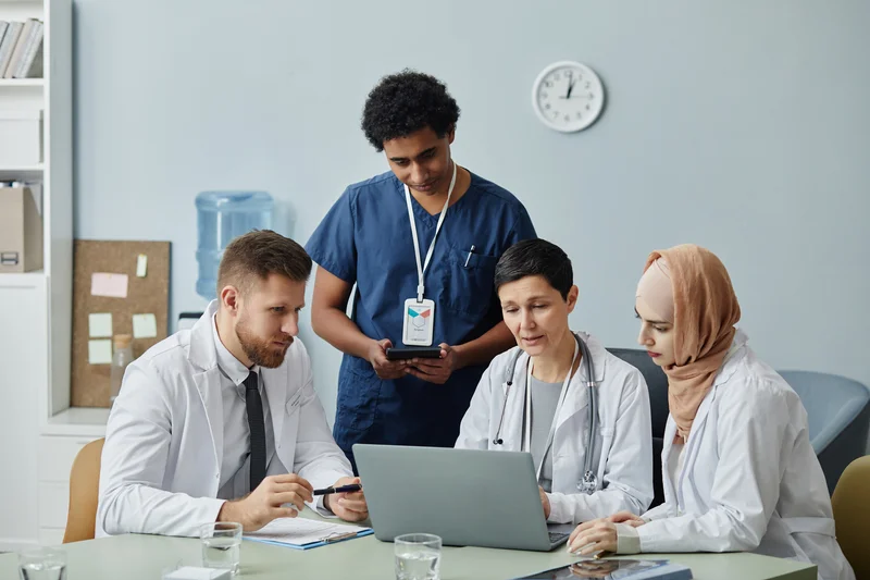 group of medical professional reading clinical record