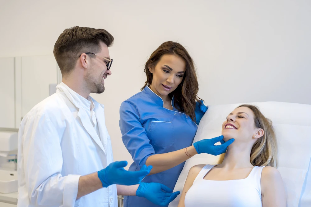 happy patient listening to dermatologist