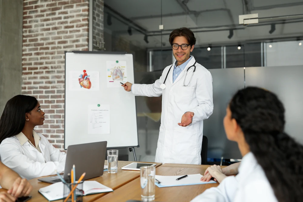 male doctor teaching to other doctor