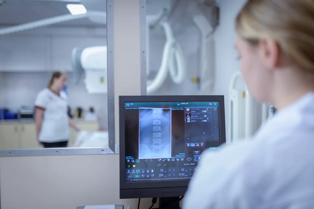 woman conducting radiologic tests