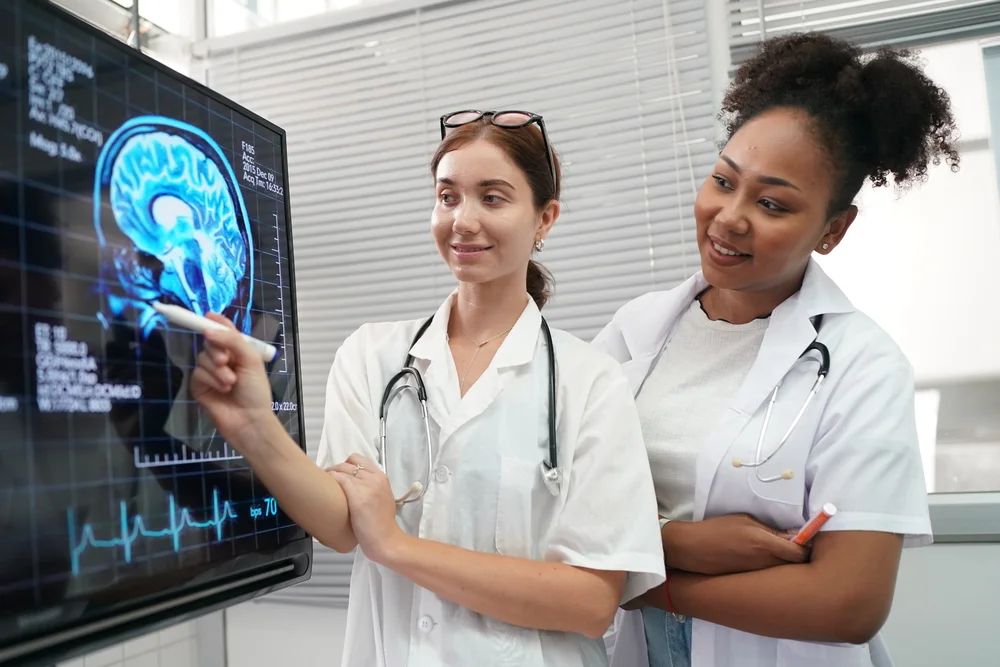 group of doctors looking at x ray on medical conference