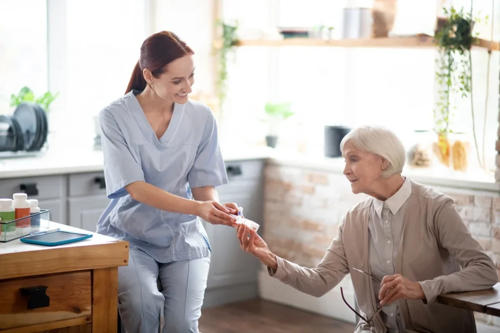 female Home Health Aide taking care of patient