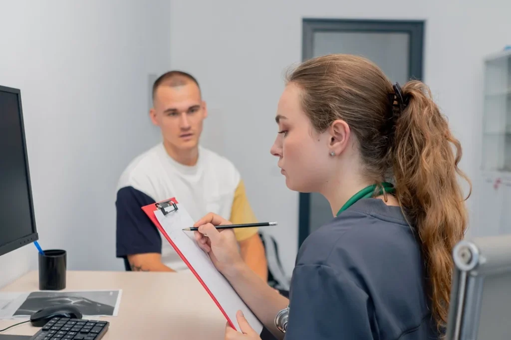 medical assistant checking patient records